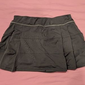 Charcoal grey LORIET tennis skort with ruffled back
